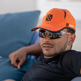 Premier Lite Adjustable Hat orange lifestyle on man