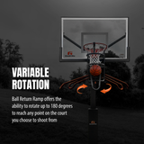 A basketball hoop with a ball return ramp in an outdoor court setting, shown with text reading 'VARIABLE ROTATION' and a description of the ball return feature. The product is highlighted in orange against a dark, desaturated background.
