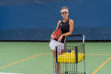 Lucy kovalova with teaching cart on pickleball court